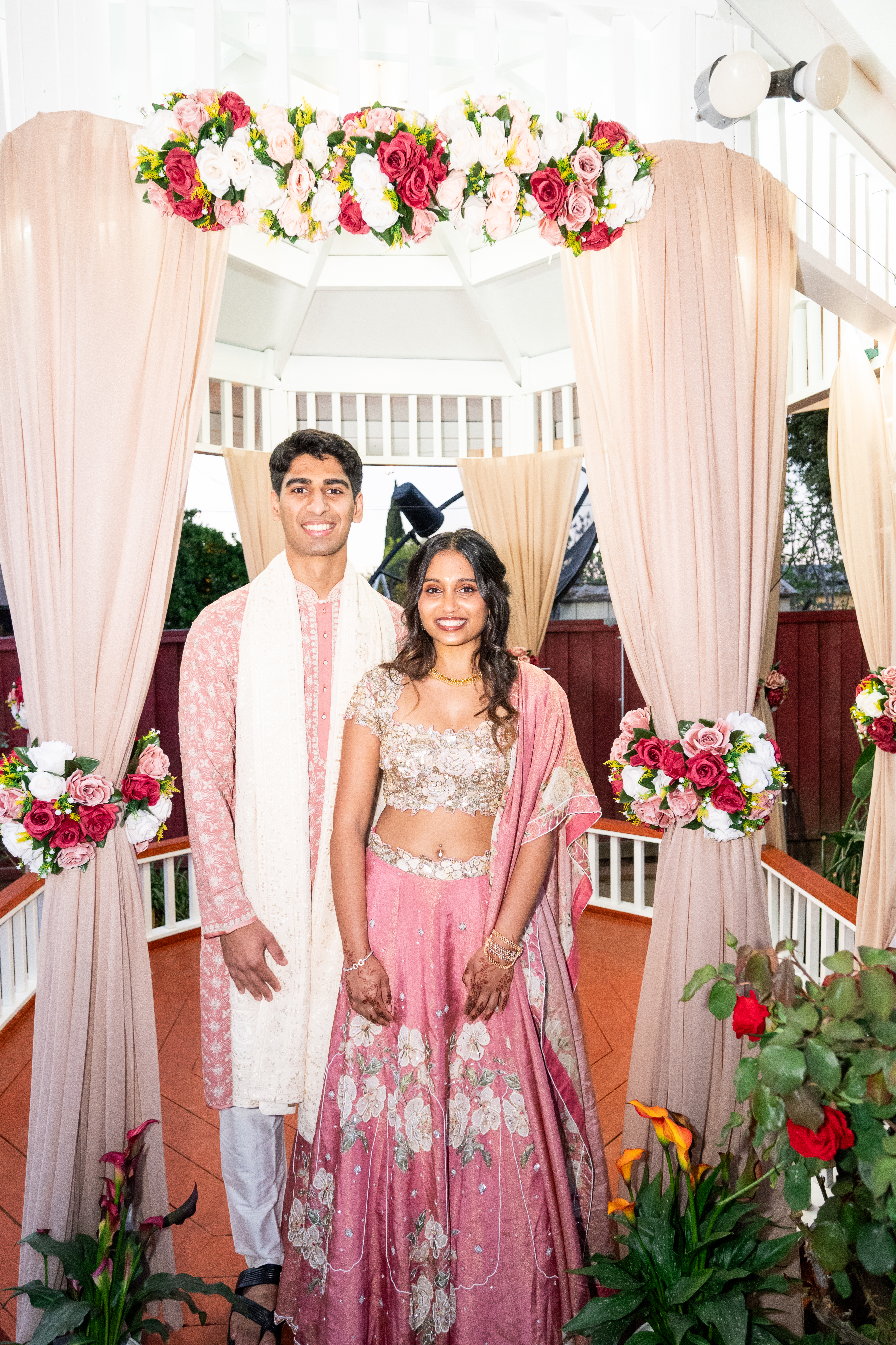 Keerthana and Yagnya standing together at the gazebo