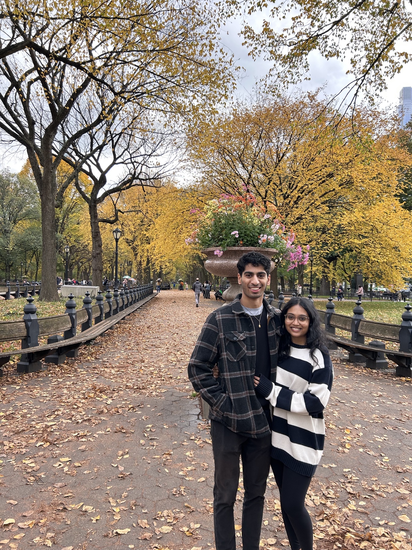 Keerthana and Yagnya in a park with fall leaves